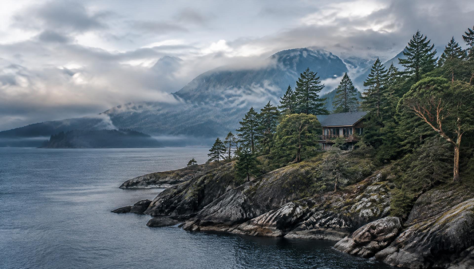Fog over Howe Sound and the rocky, forested Bowen Island shoreline